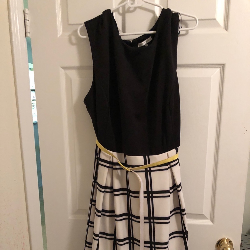 Sleeveless black and white dress with yellow belt